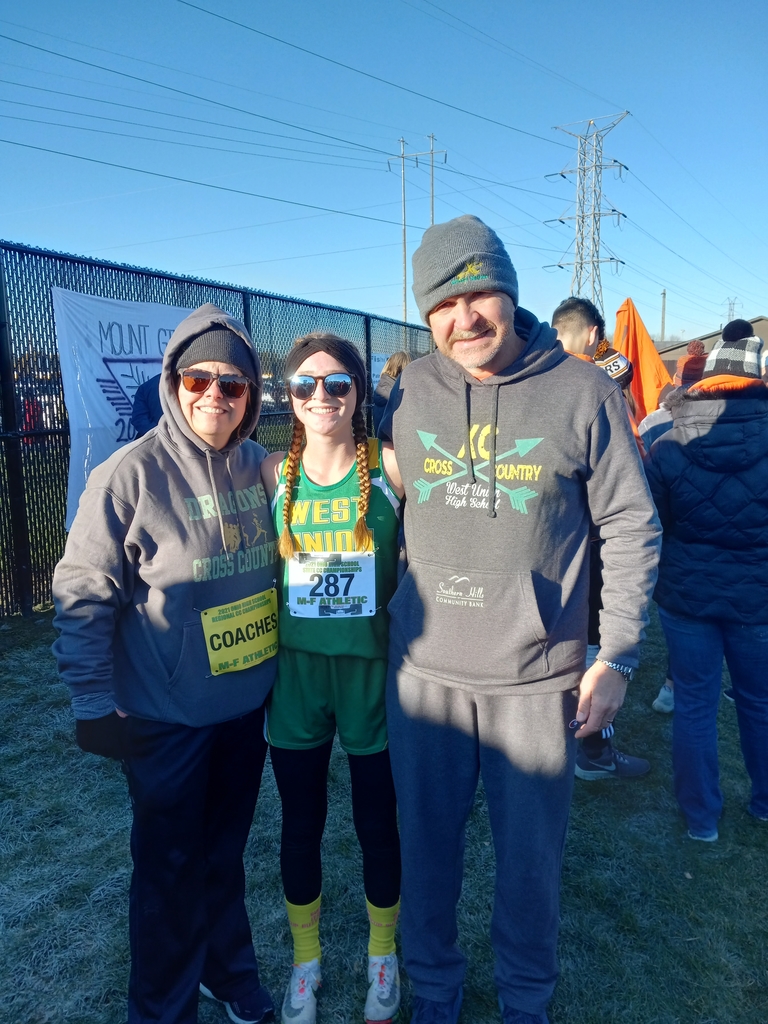 Addie Shupert and Coaches Donnie and Megan McCarty at the State XC meet